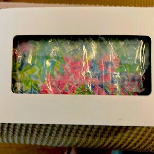 New in packaging, hard clutch with gold hardware.